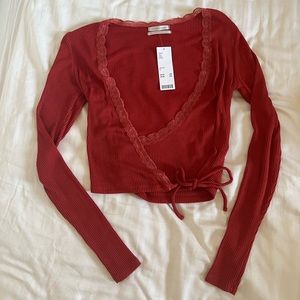 Urban outfitters red lace long sleeve wrap top, size small
